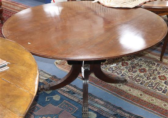 An inlaid mahogany oval tilt top dining table W.158cm